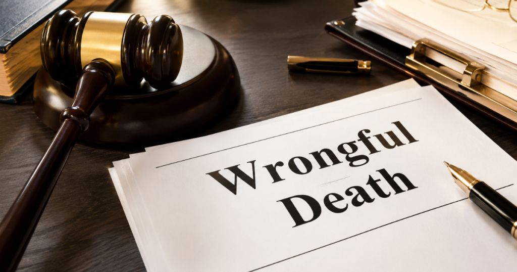 Legal desk with gavel and documents labeled โWrongful Deathโ on a wooden table.